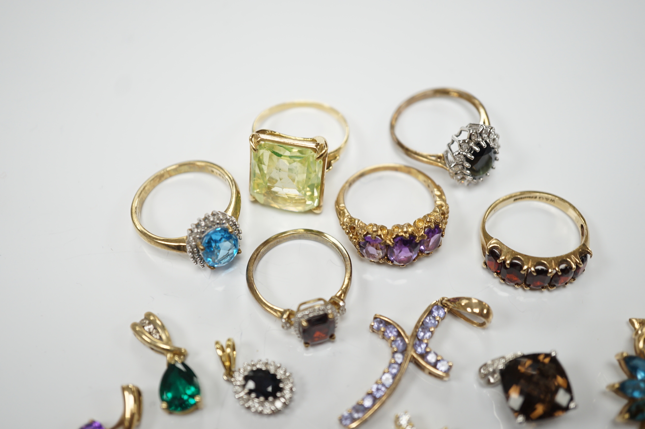 Five assorted modern 9ct gold and gem set rings, including garnet and amethyst, one other yellow metal and gem set ring, six assorted modern 9ct gold and gem set pendants, two other pendants including diamond set cross a